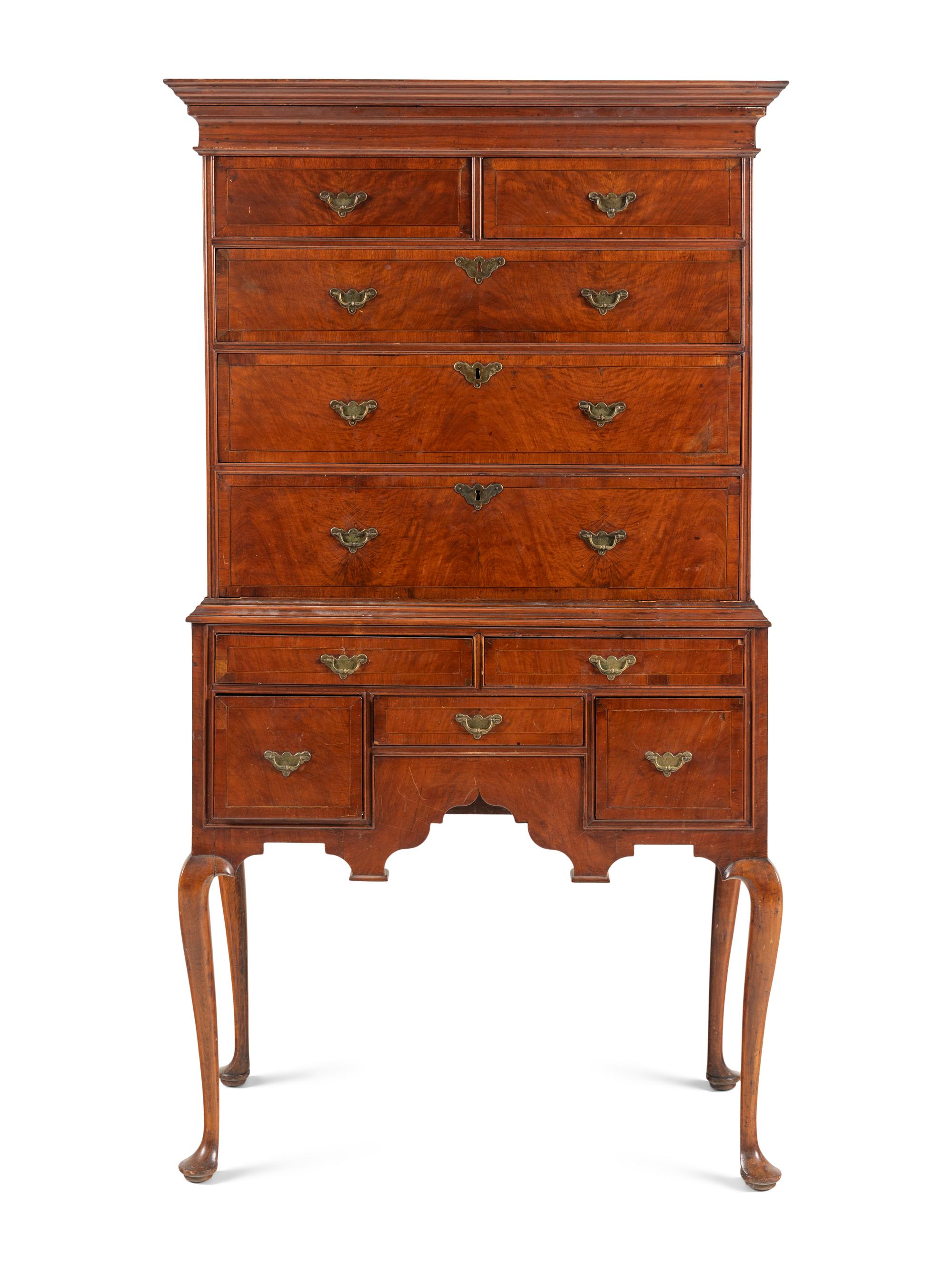 A Queen Anne Figured and Veneered Walnut Flat-Top High Chest Of Drawers