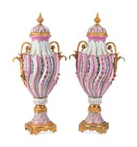 A Pair of Gilt Bronze Mounted Sèvres Style Porcelain Urns