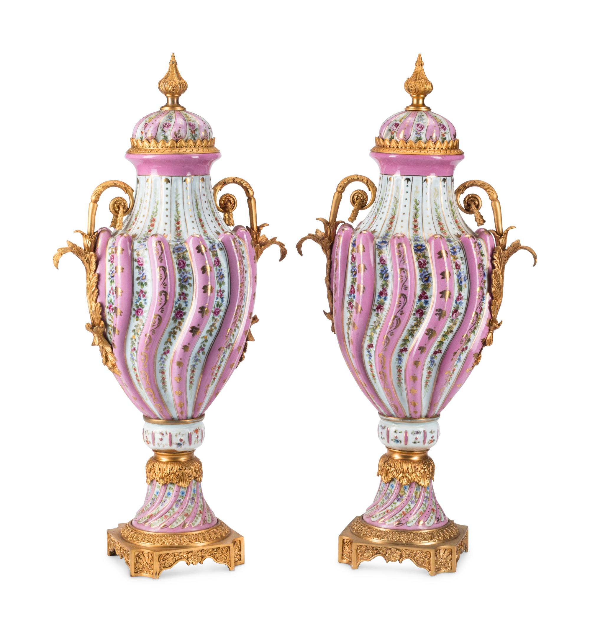 A Pair of Gilt Bronze Mounted Sèvres Style Porcelain Urns