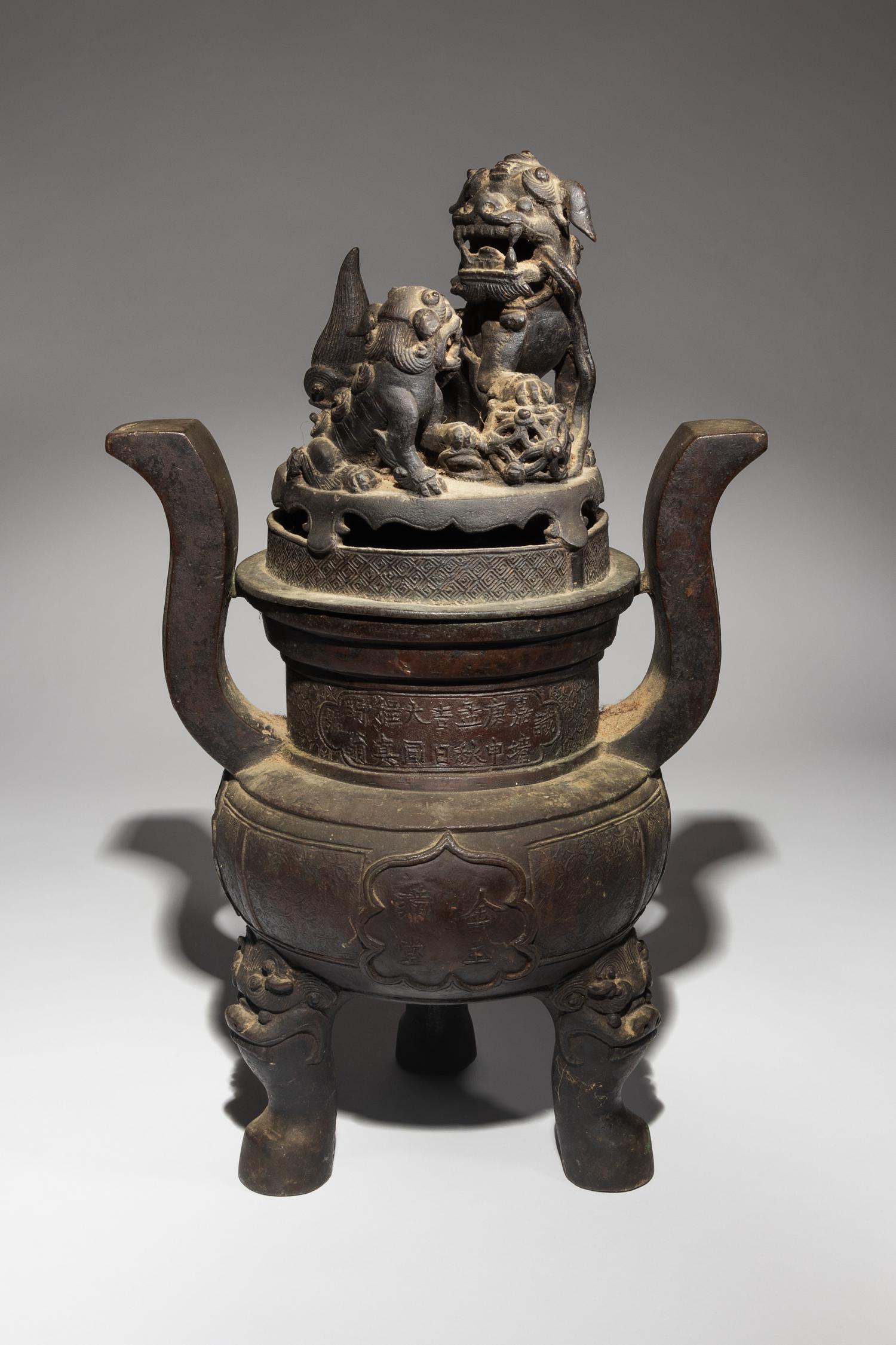 A Bronze Tripod Incense Burner and Cover