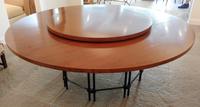 A Mahogany and Metal Dining Table