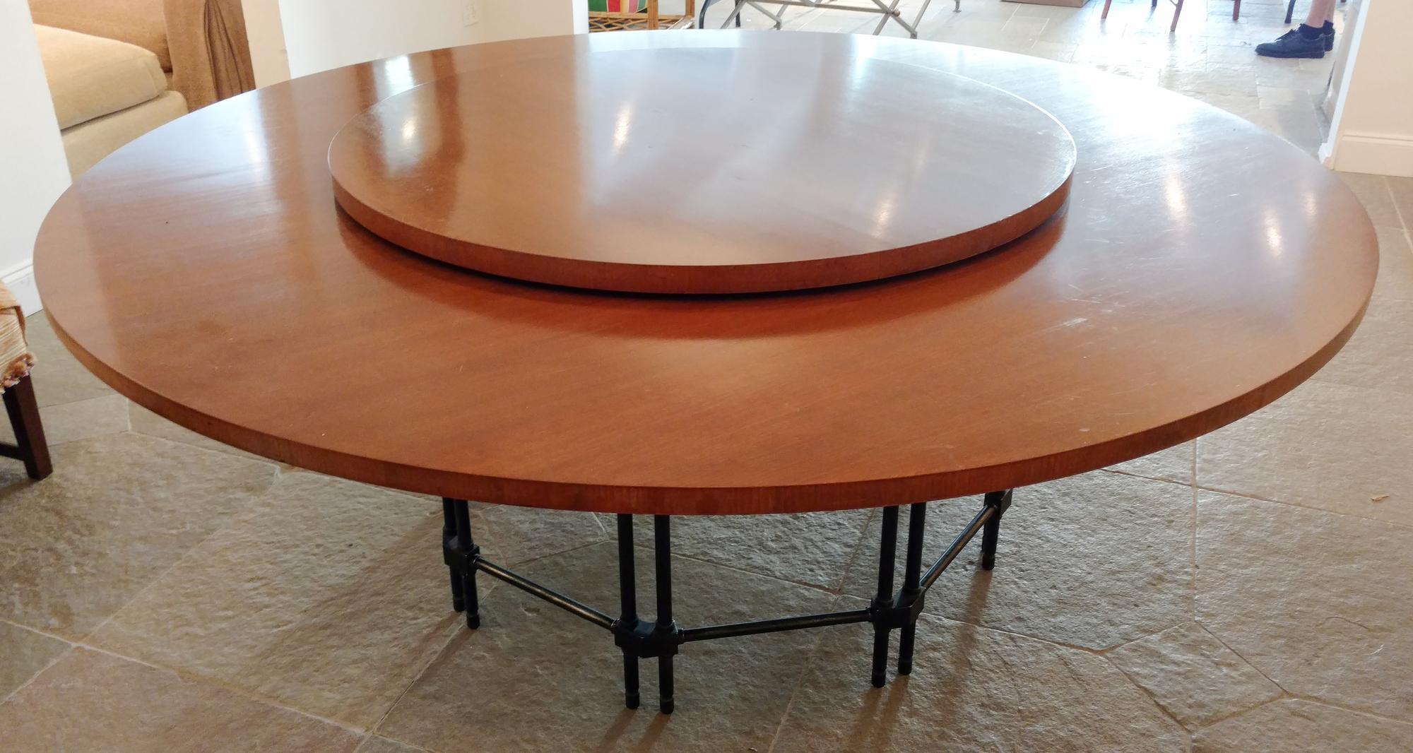 A Mahogany and Metal Dining Table