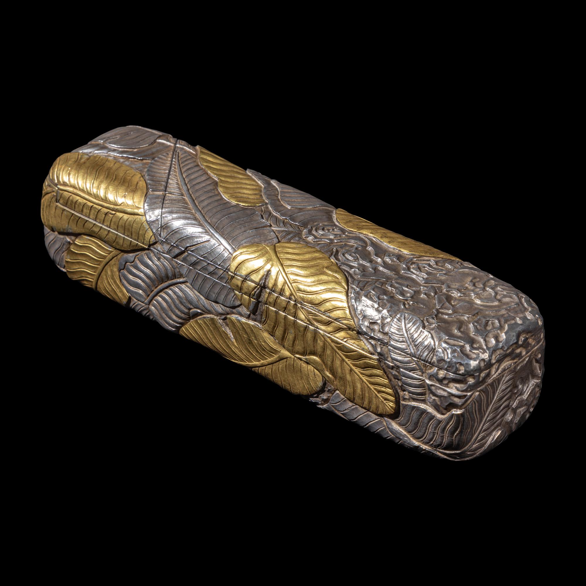 A Chinese Parcel-Gilt Silver Repoussé 'Plantain Leaves' Rectangular Scroll Box, Incised Qianlong Mark 清乾隆乙卯（1796）銀鎏金鏨蕉葉紋手卷機關盒