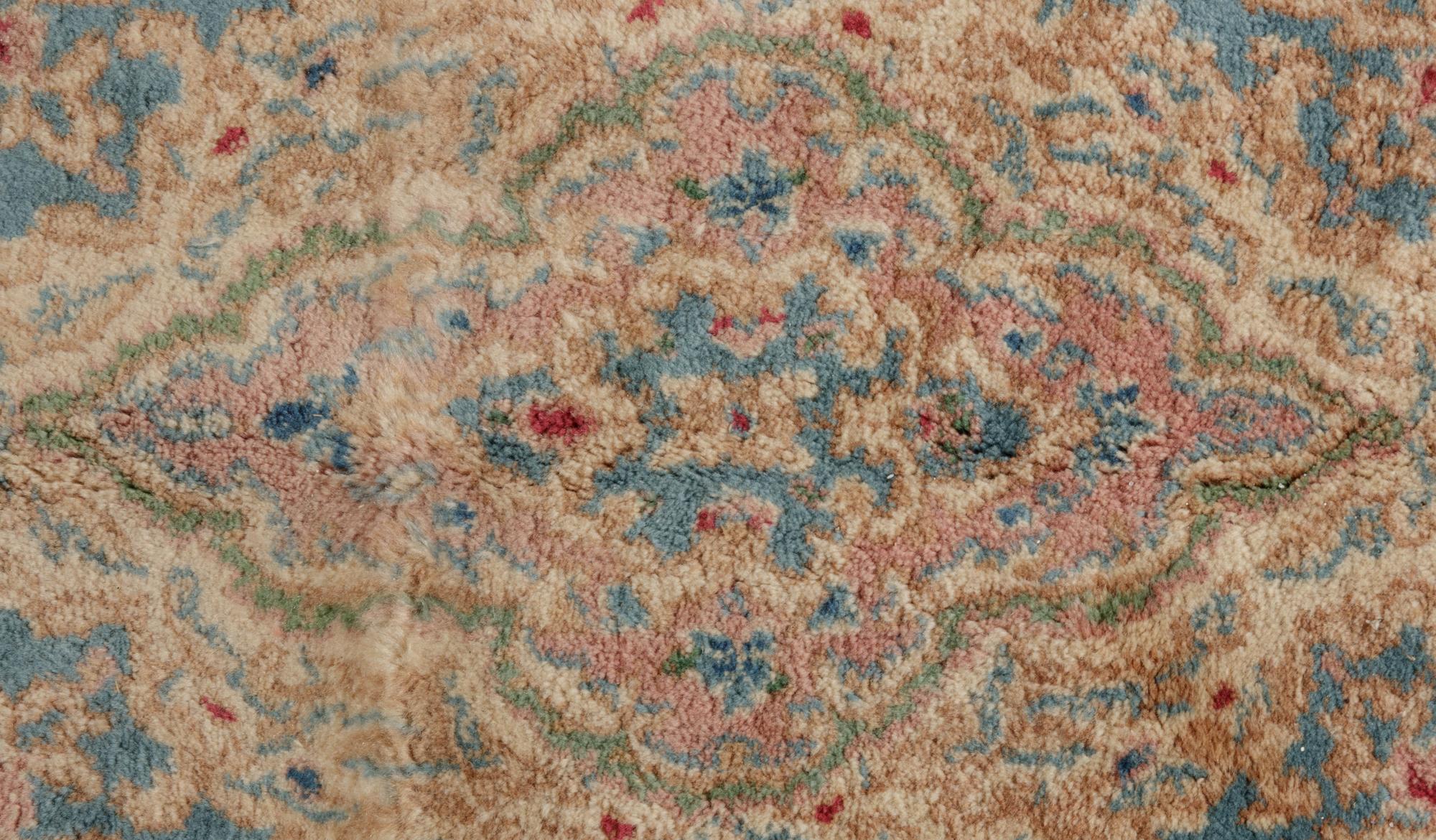 A Kirman Wool Rug