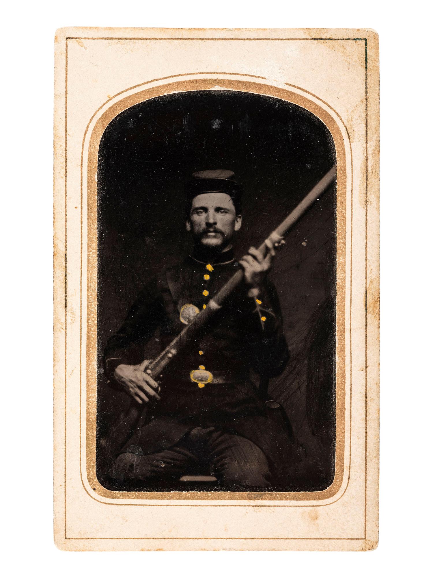 [CIVIL WAR]. A group of 3 tintypes of soldiers, incl. portrait of an armed soldier and portraits of soldier and wife housed in locket.