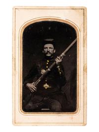 [CIVIL WAR]. A group of 3 tintypes of soldiers, incl. portrait of an armed soldier and portraits of soldier and wife housed in locket.