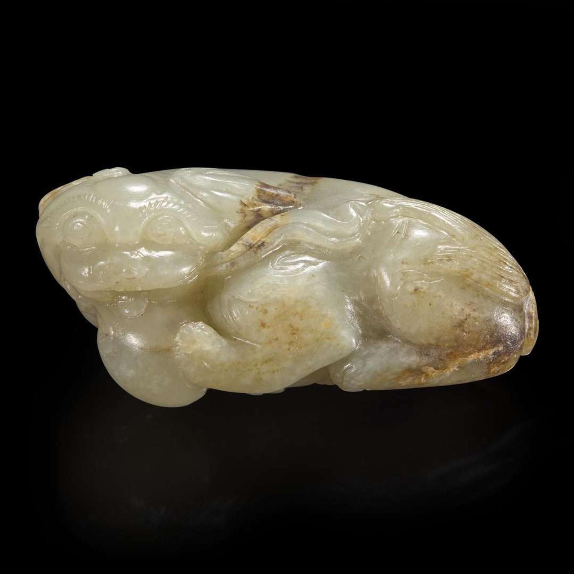 A Chinese carved pale celadon-grey and beige jade Buddhist lion 青灰玉雕太狮少狮 Qing dynasty ?