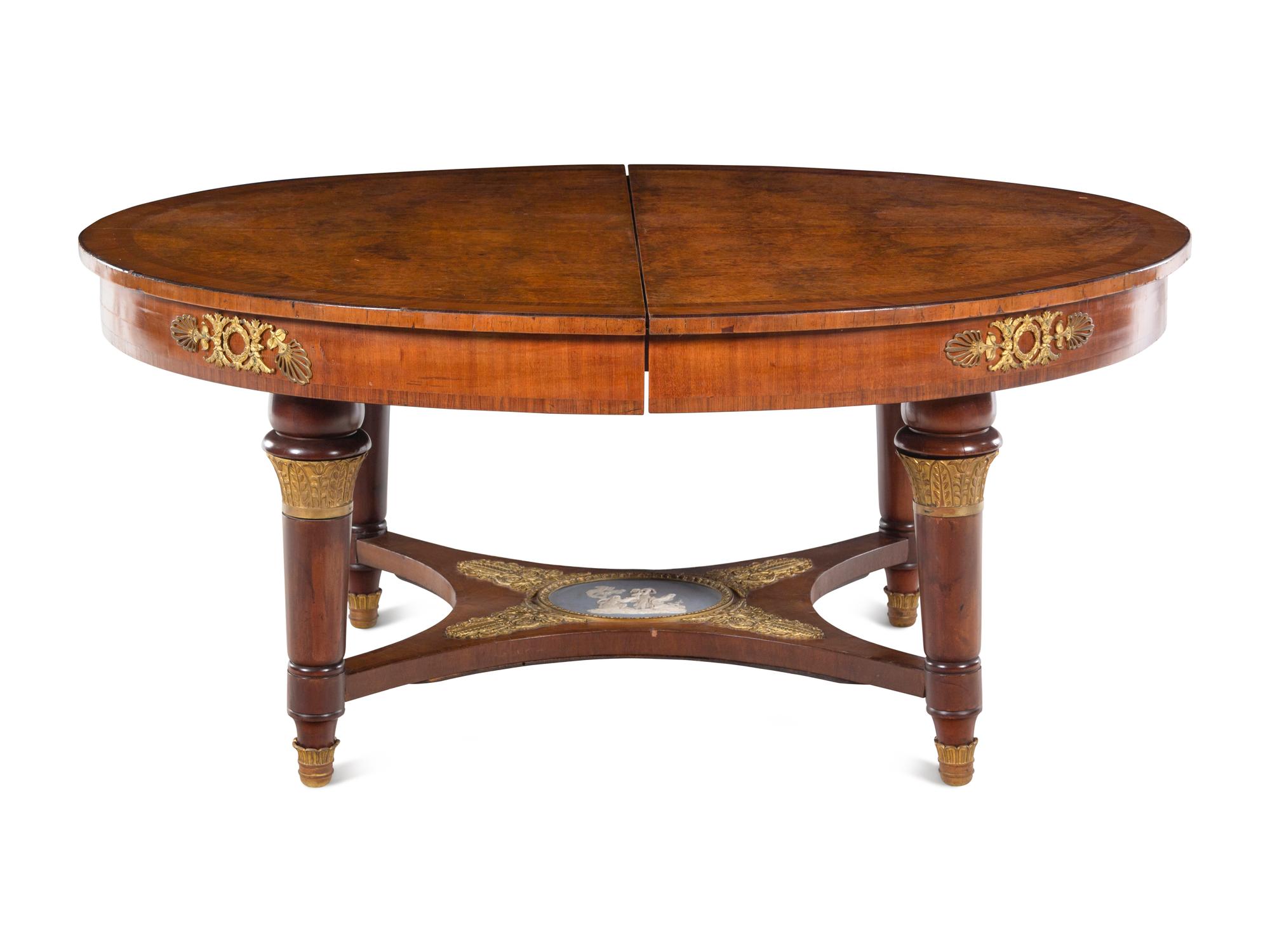 A French Gilt Bronze and Jasperware Mounted Burlwood Dining Suite