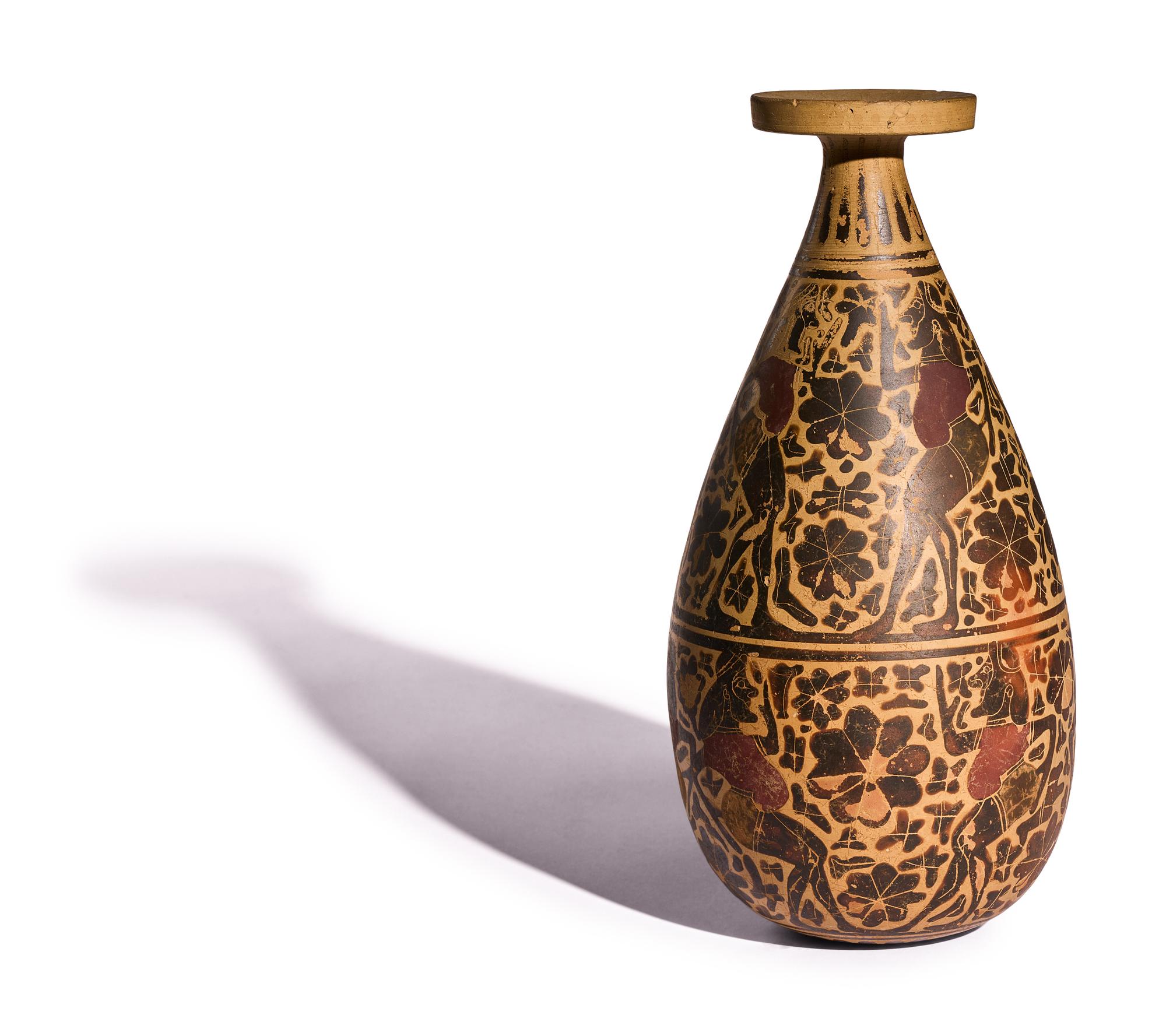 A Corinthian Black-Figured Alabastron with Padded Dancers