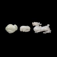 Three Chinese White Jade 'Mythical Beast' Jade Carvings, 20th Century 近代 白玉靈獸把件三枚
