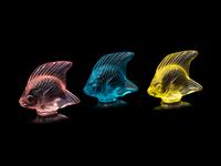 A Lalique Perfume Bottle and Three Lalique Fish