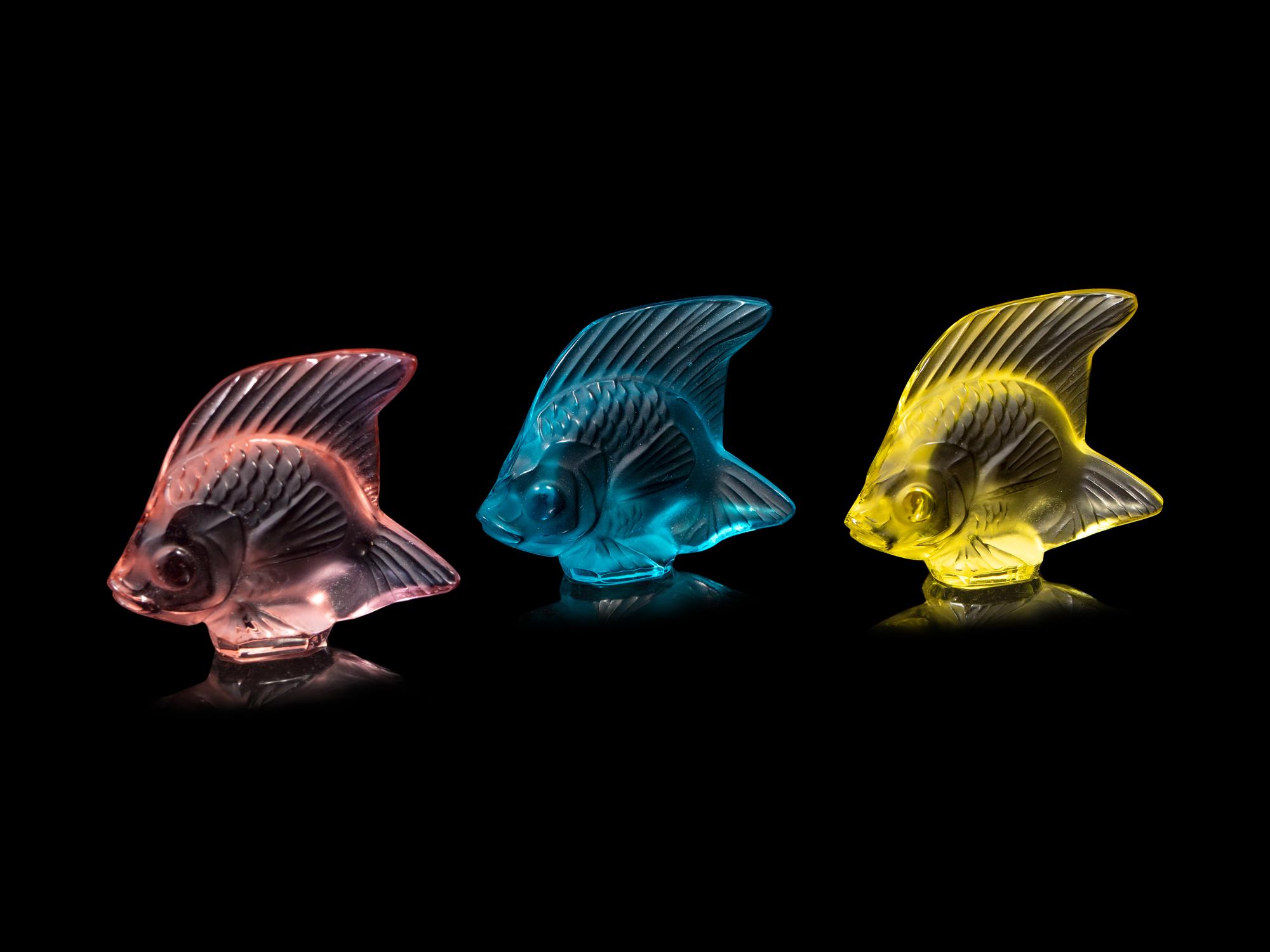 A Lalique Perfume Bottle and Three Lalique Fish