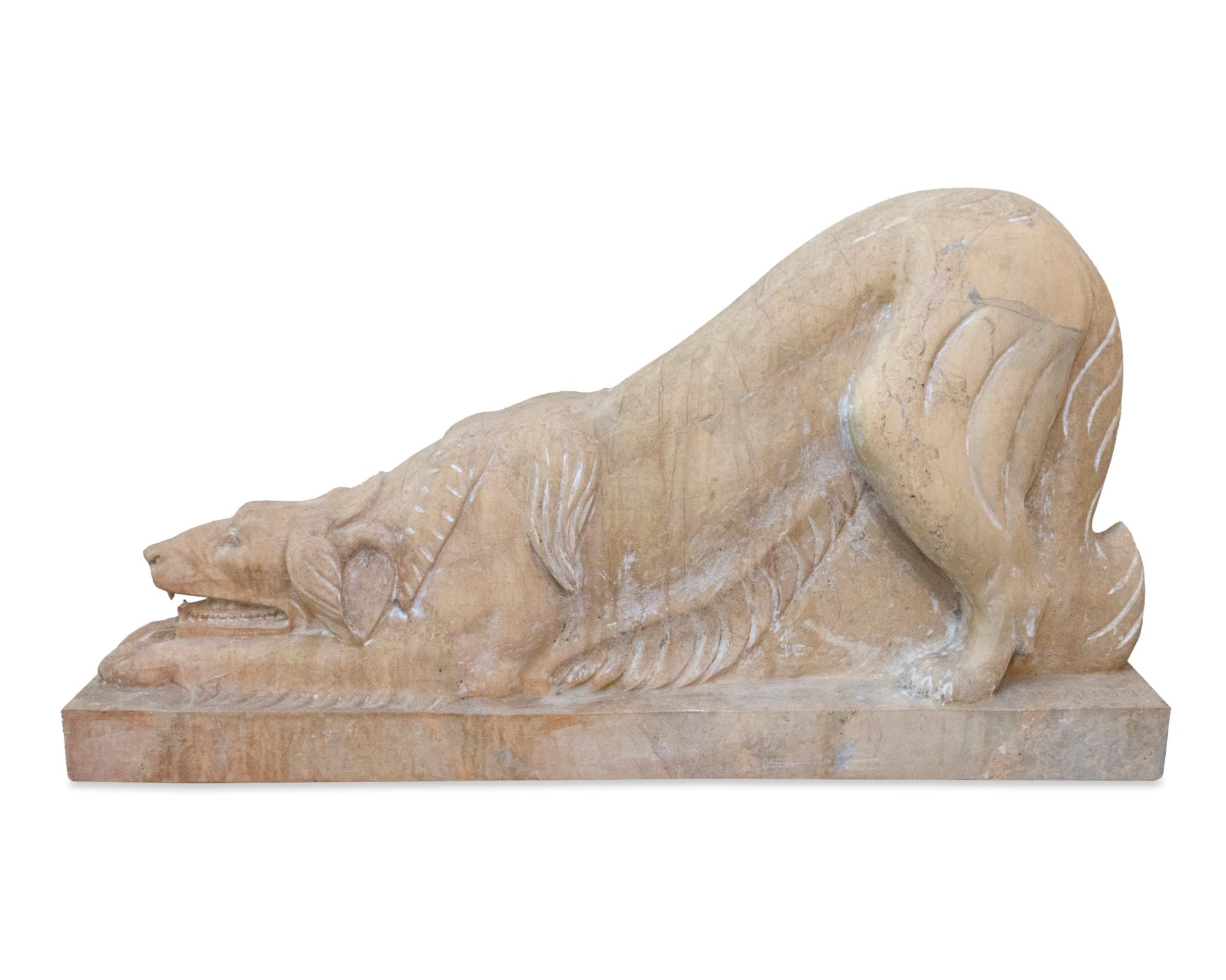 A Pair of Carved Marble Crouching Dogs — 20TH CENTURY