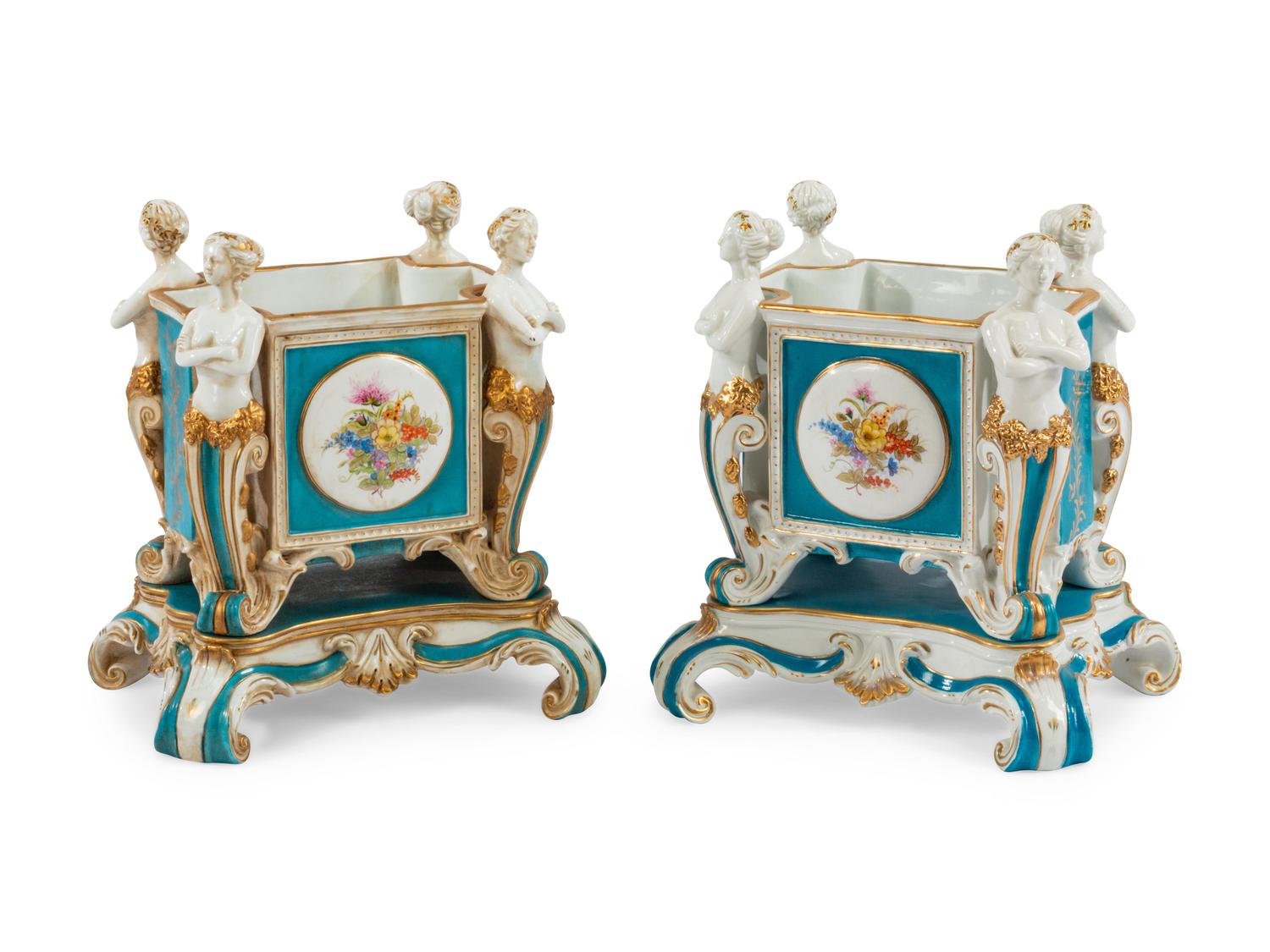 A Pair of German Porcelain Figural Jardinières