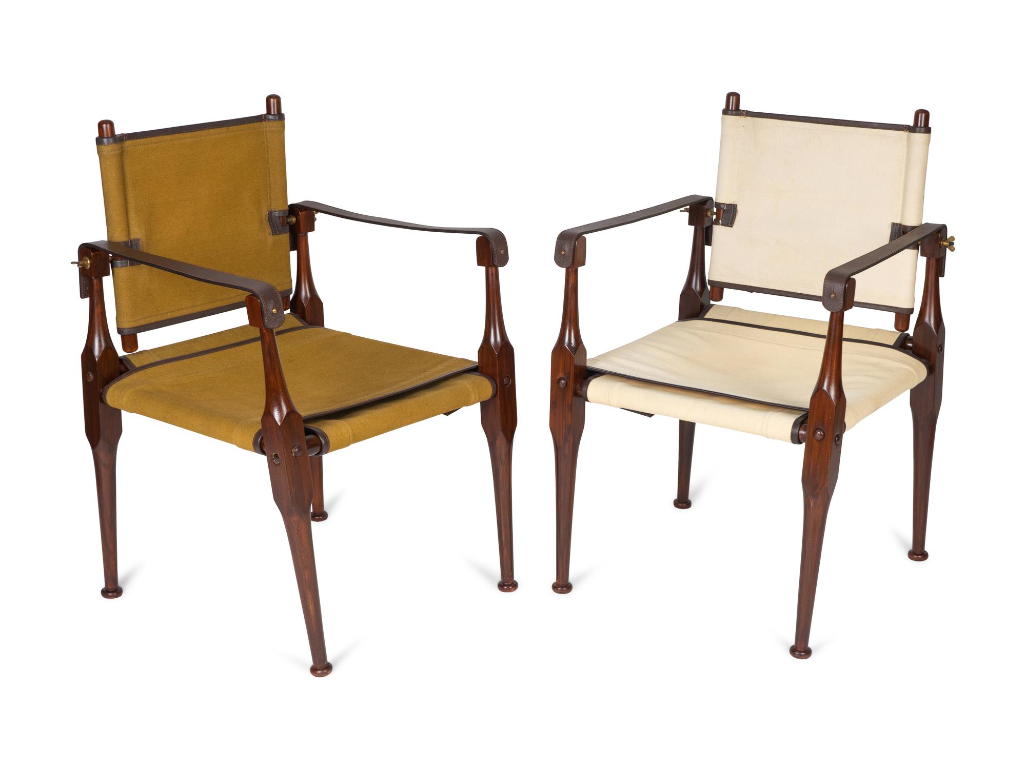 A Pair of British Colonial Style Mahogany, Canvas and Leather Strap Campaign Chairs — 20TH CENTURY