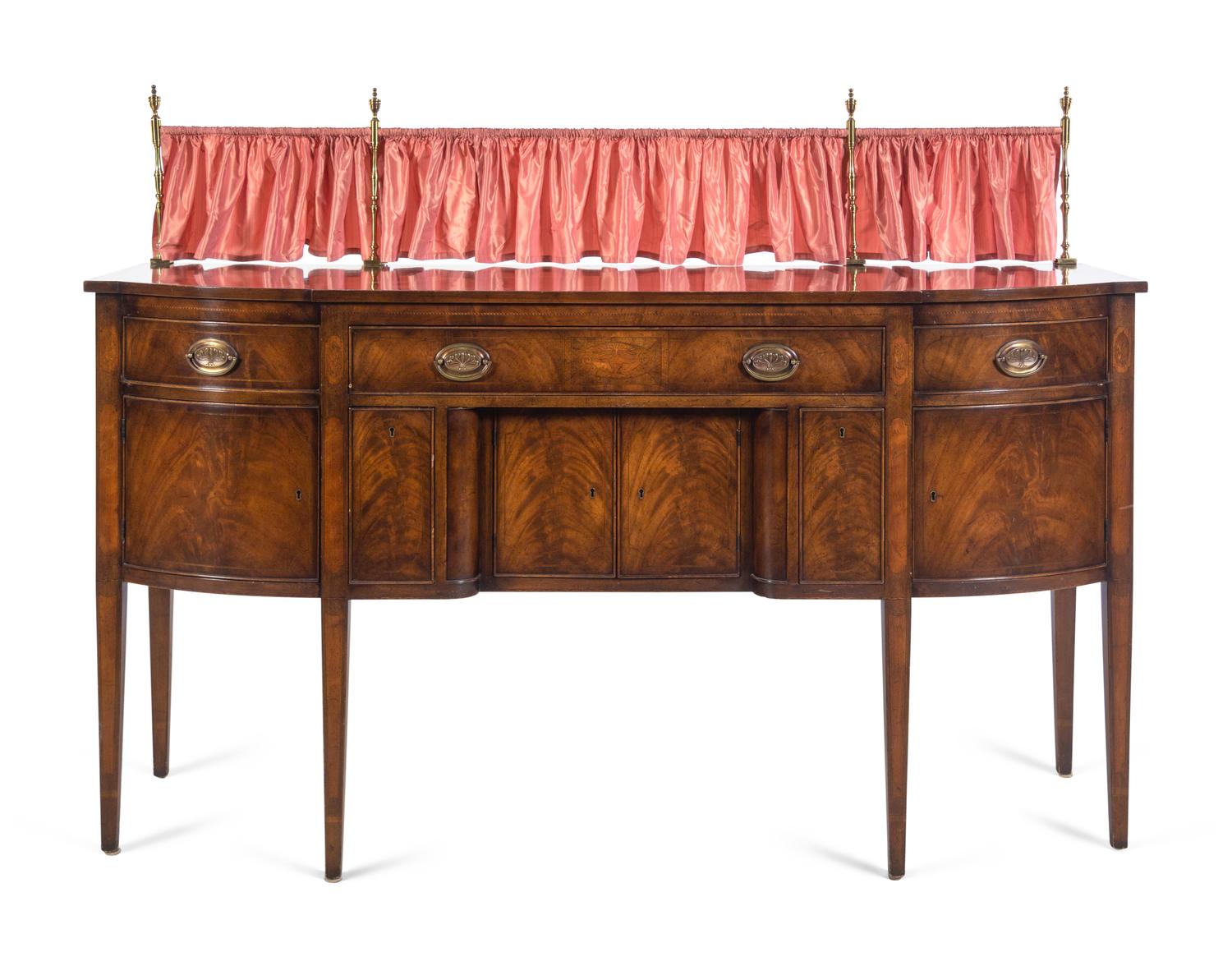 A Regency Style Mahogany Sideboard with Silk Drape on a Brass Gallery