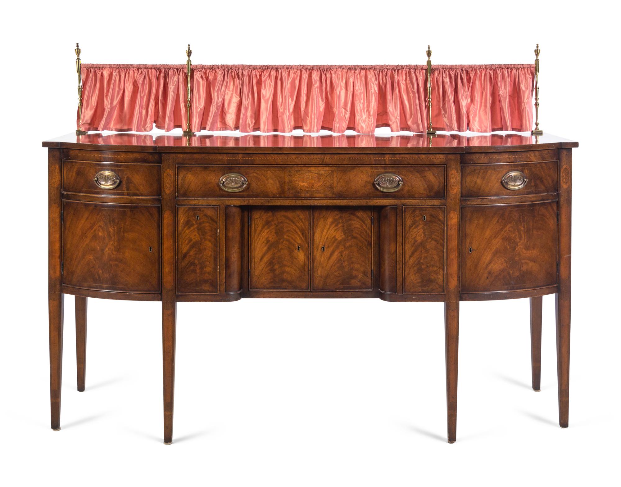 A Regency Style Mahogany Sideboard with Silk Drape on a Brass Gallery