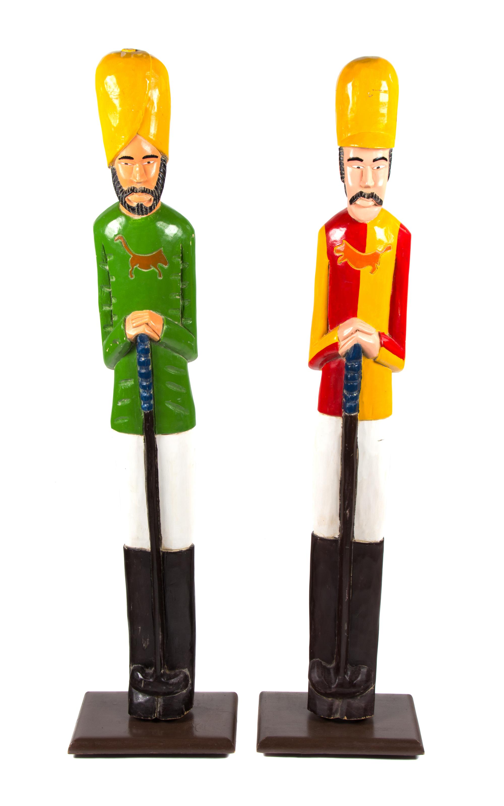 A Pair of Painted Wood Figures Height 49 inches. — 20TH CENTURY