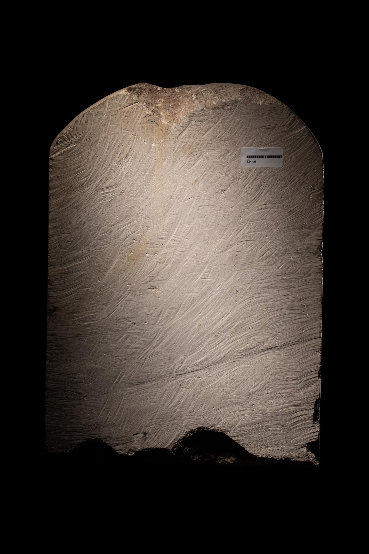 An Egyptian-Style Limestone Round-Topped Stele