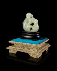 A Celadon Jade 'Monkey and Peach' Group