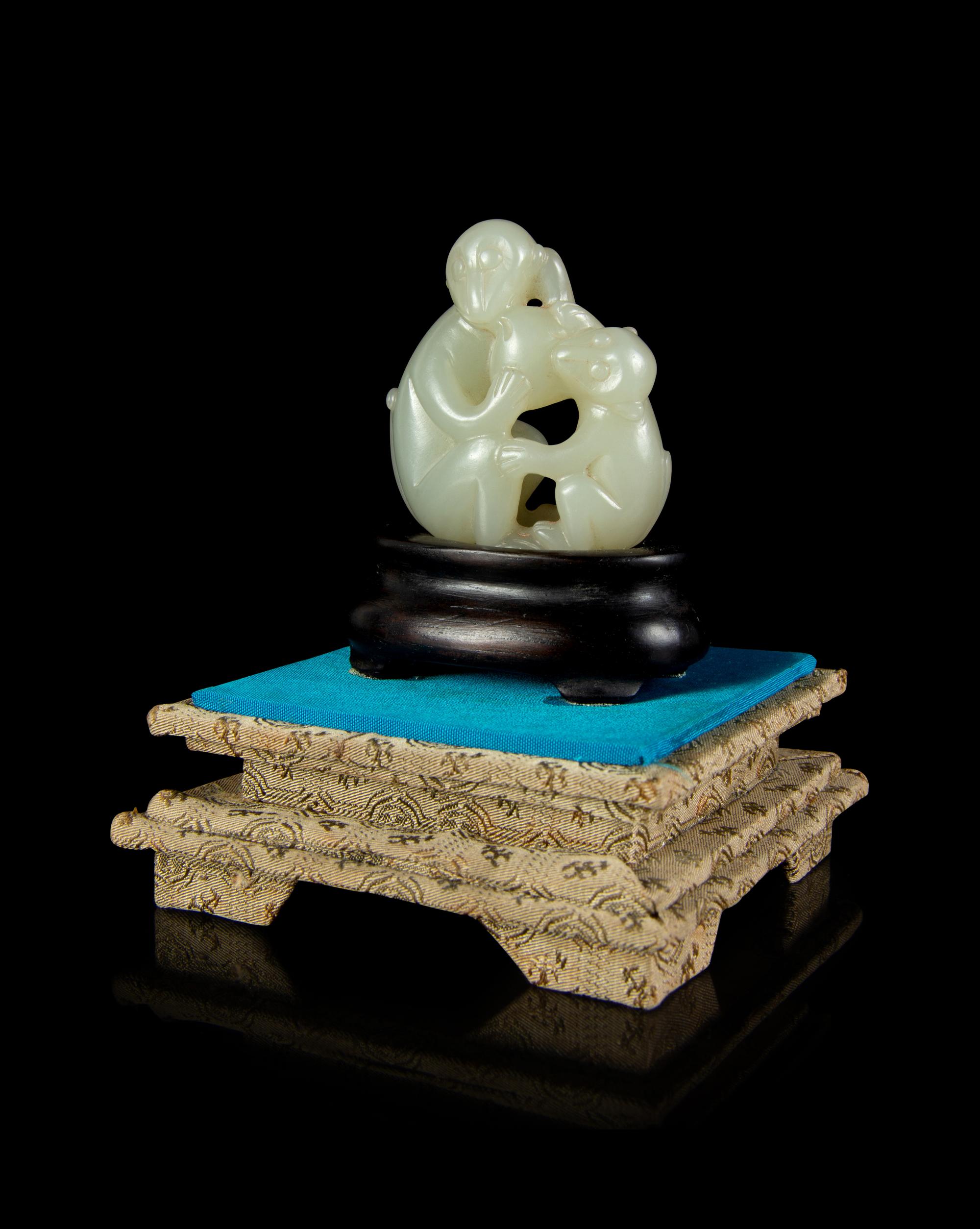 A Celadon Jade 'Monkey and Peach' Group