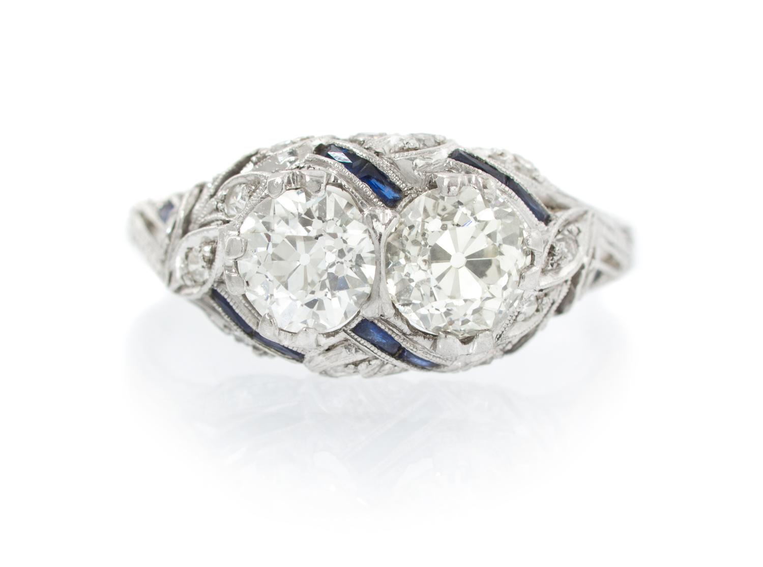 An Art Deco Platinum, Diamond and Synthetic Sapphire Ring, 2.70 dwts.