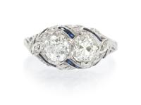 An Art Deco Platinum, Diamond and Synthetic Sapphire Ring, 2.70 dwts.