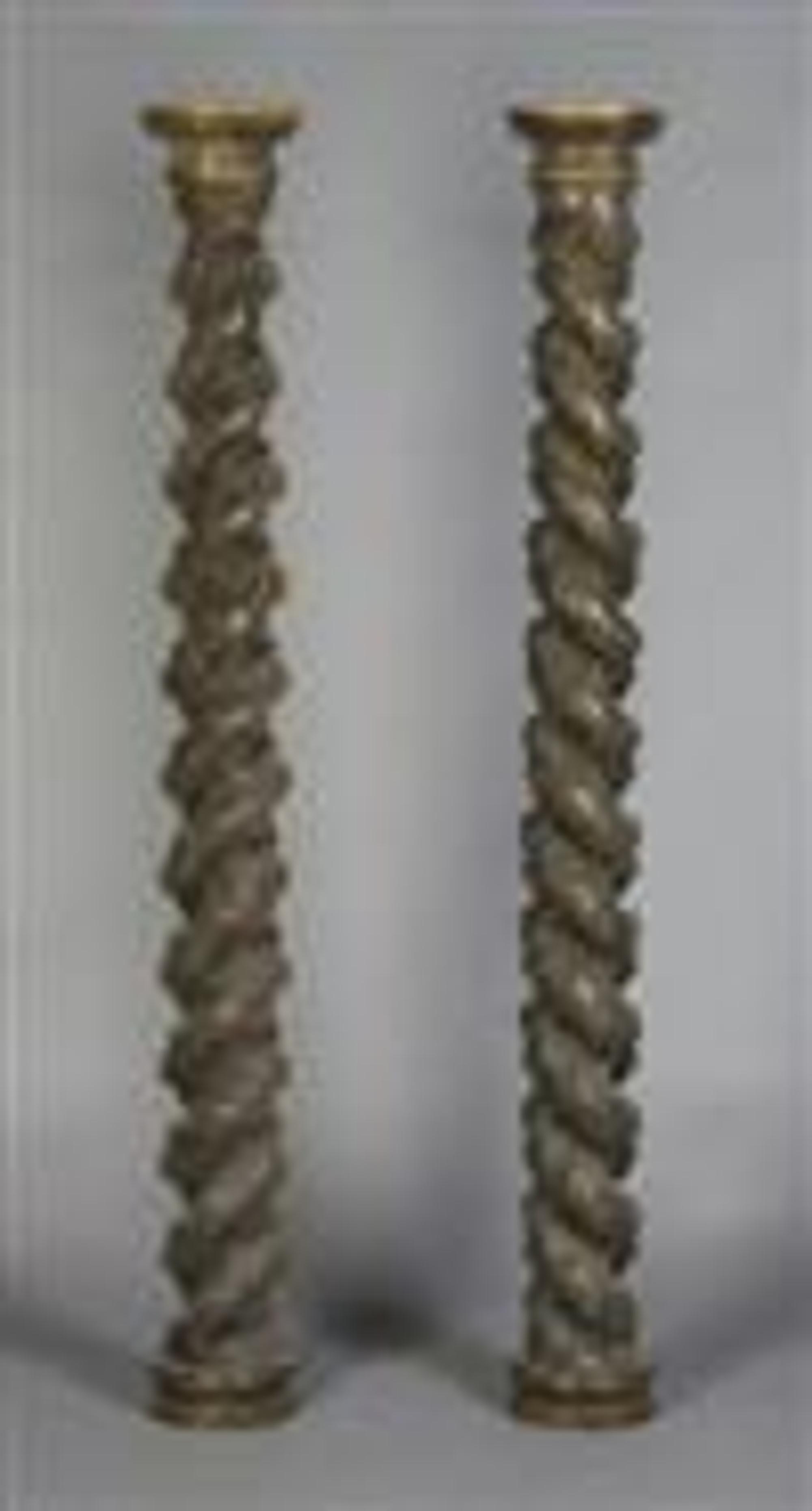 A Pair of Carved Solomonic Columns, Height 65 1/4 inches.