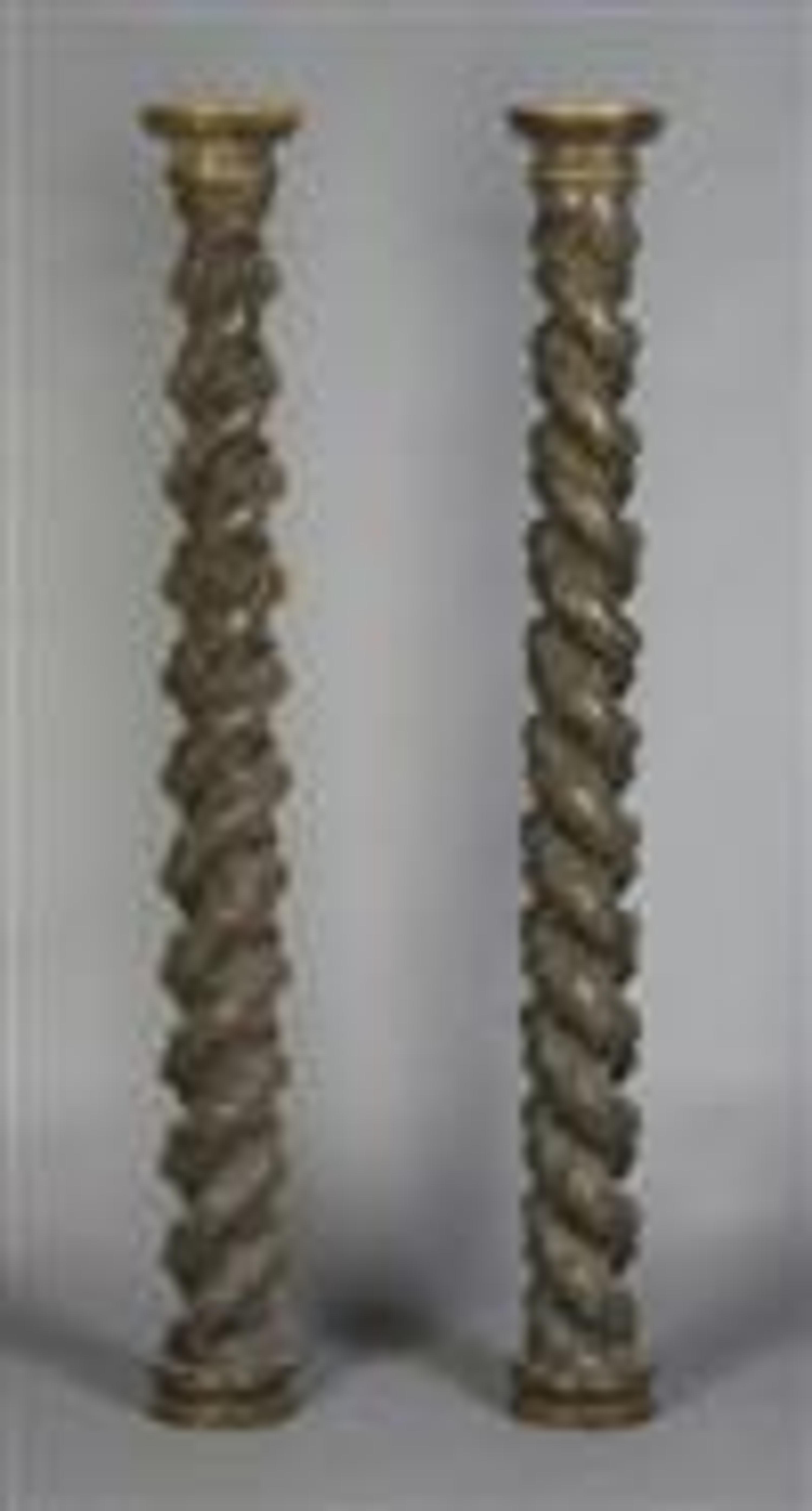 A Pair of Carved Solomonic Columns, Height 65 1/4 inches.