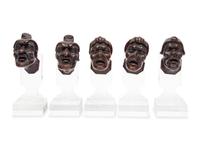 A Set of Five Italian Baroque Carved Walnut Heads of Grotesques