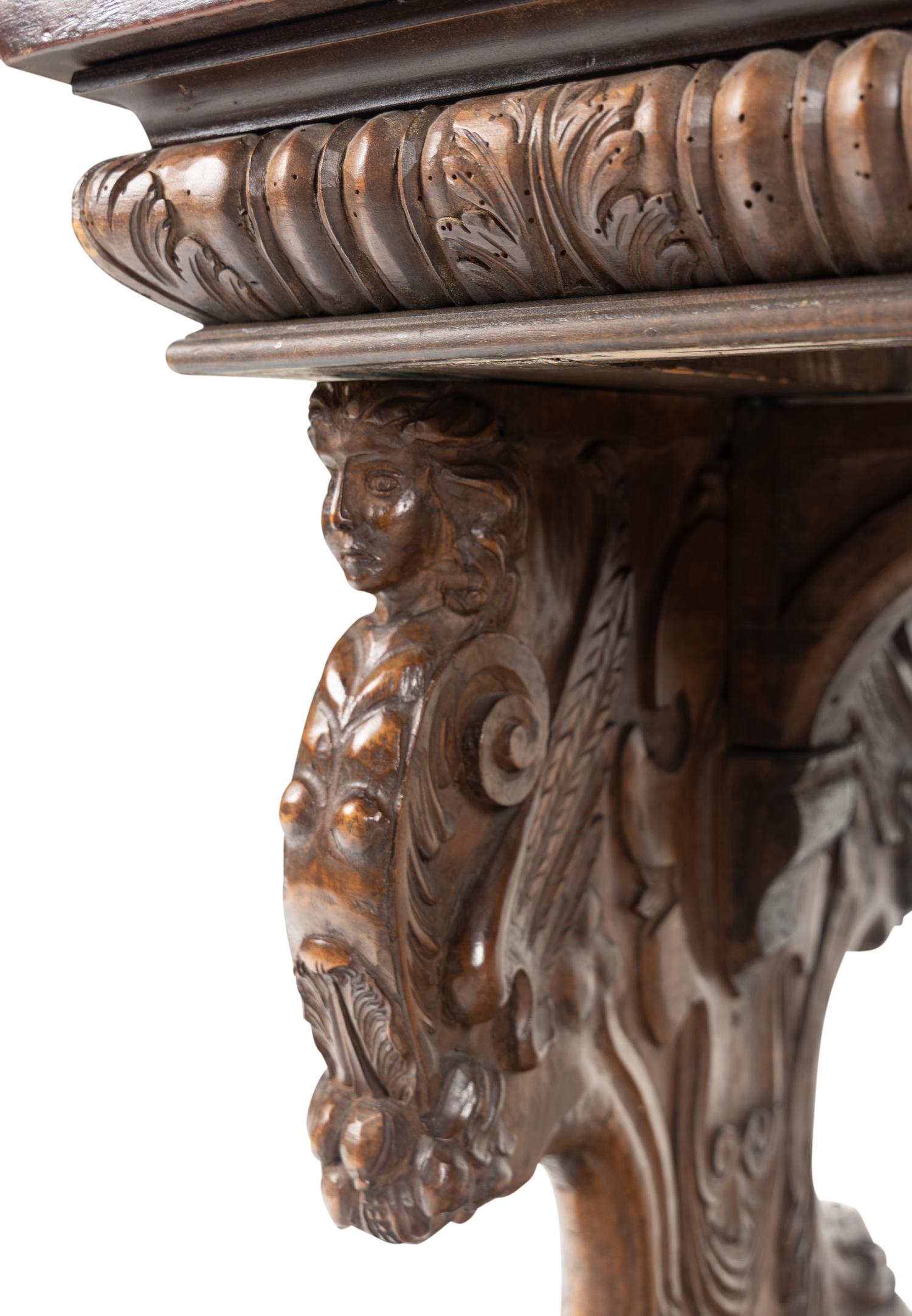 A Florentine Renaissance Style Carved Walnut Trestle Table