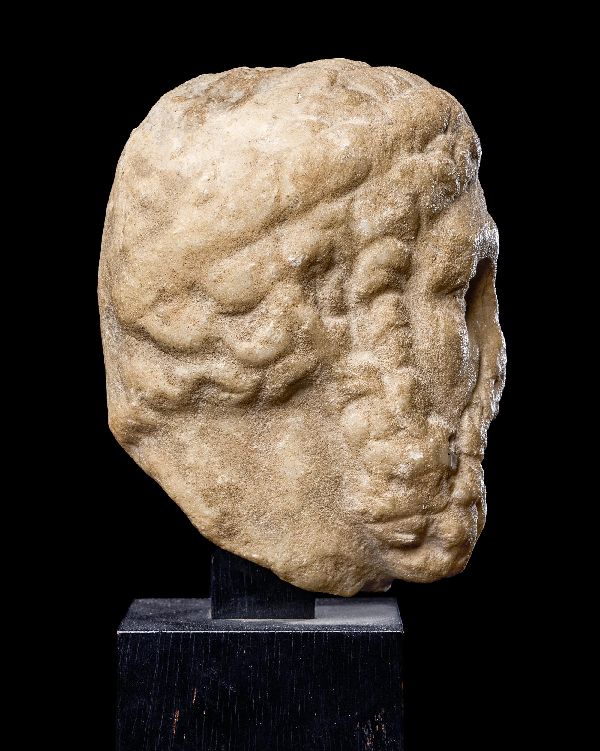 A Roman Marble Portrait Head of a Beaded Man