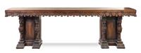 An Italian Baroque Style Oak Console Table Height 36 x width 21 1/2 x depth 120 1/2 inches.