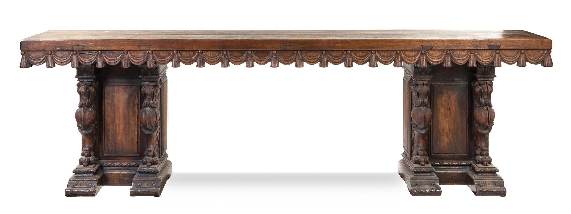 An Italian Baroque Style Oak Console Table Height 36 x width 21 1/2 x depth 120 1/2 inches.