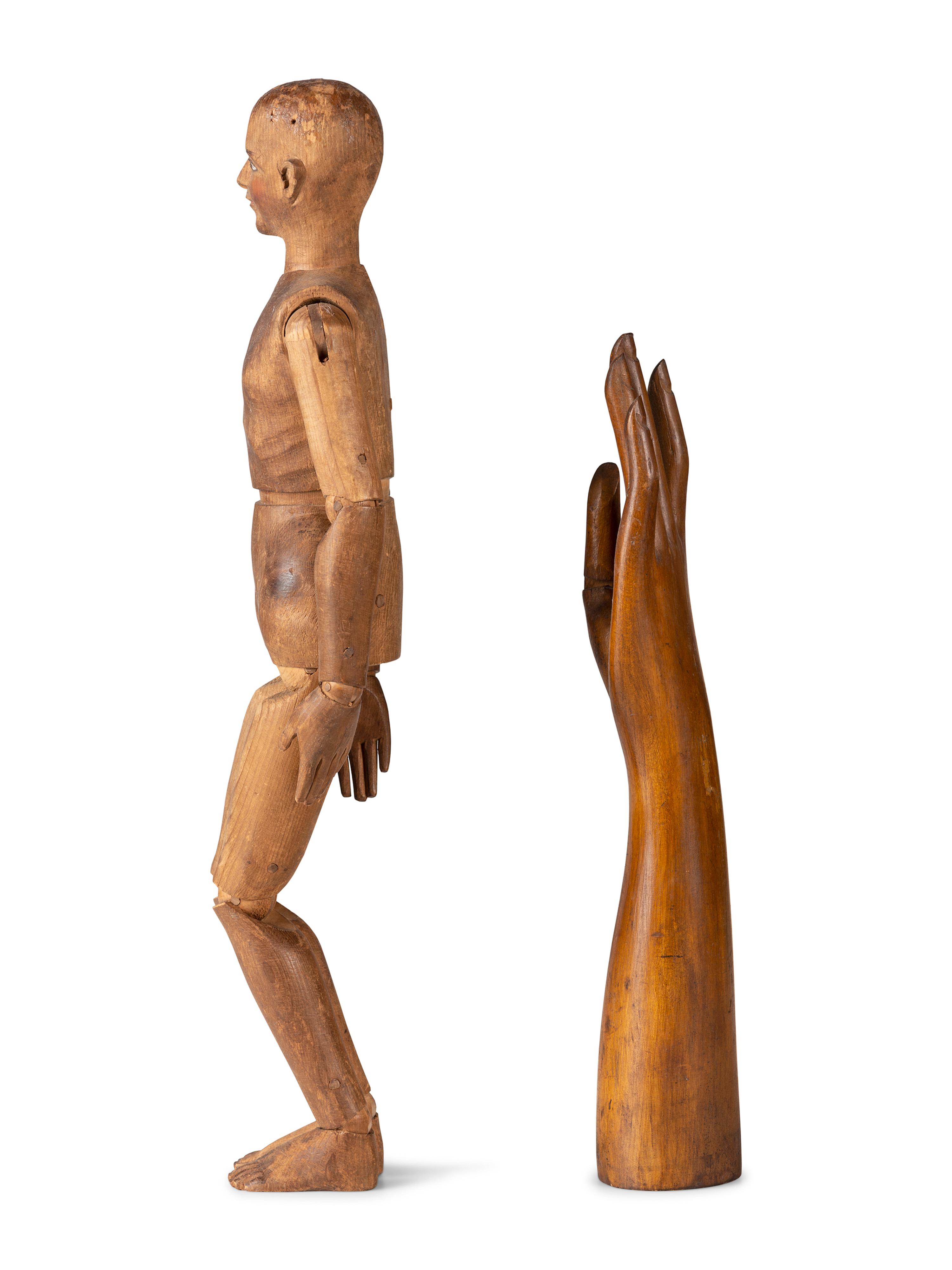 An Articulated Wooden Mannequin and a Carved Wooden Hand with Articulated Thumb
