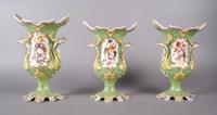 A Three Piece Porcelain Garniture Set, probably Rockingham, Height of tallest 11 3/4 inches.