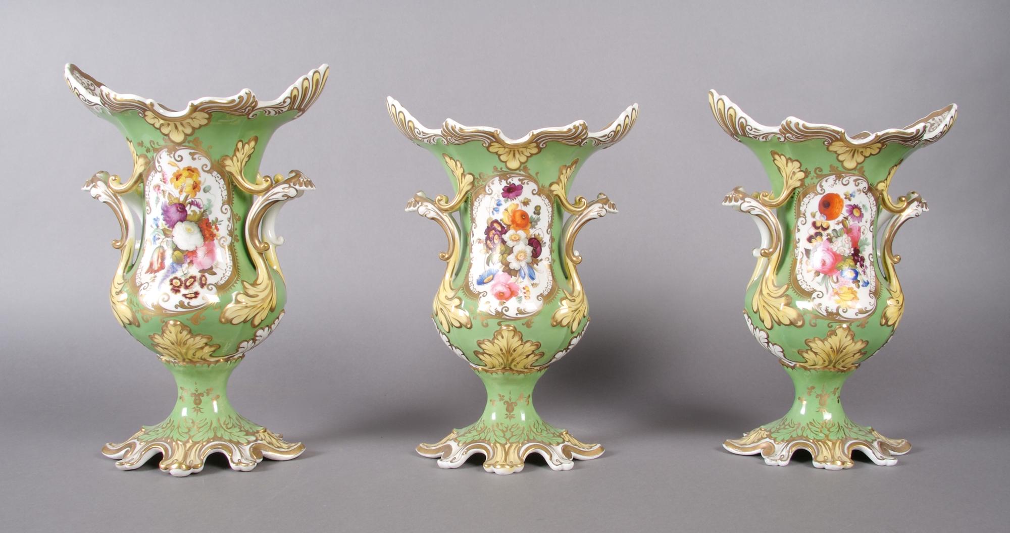 A Three Piece Porcelain Garniture Set, probably Rockingham, Height of tallest 11 3/4 inches.