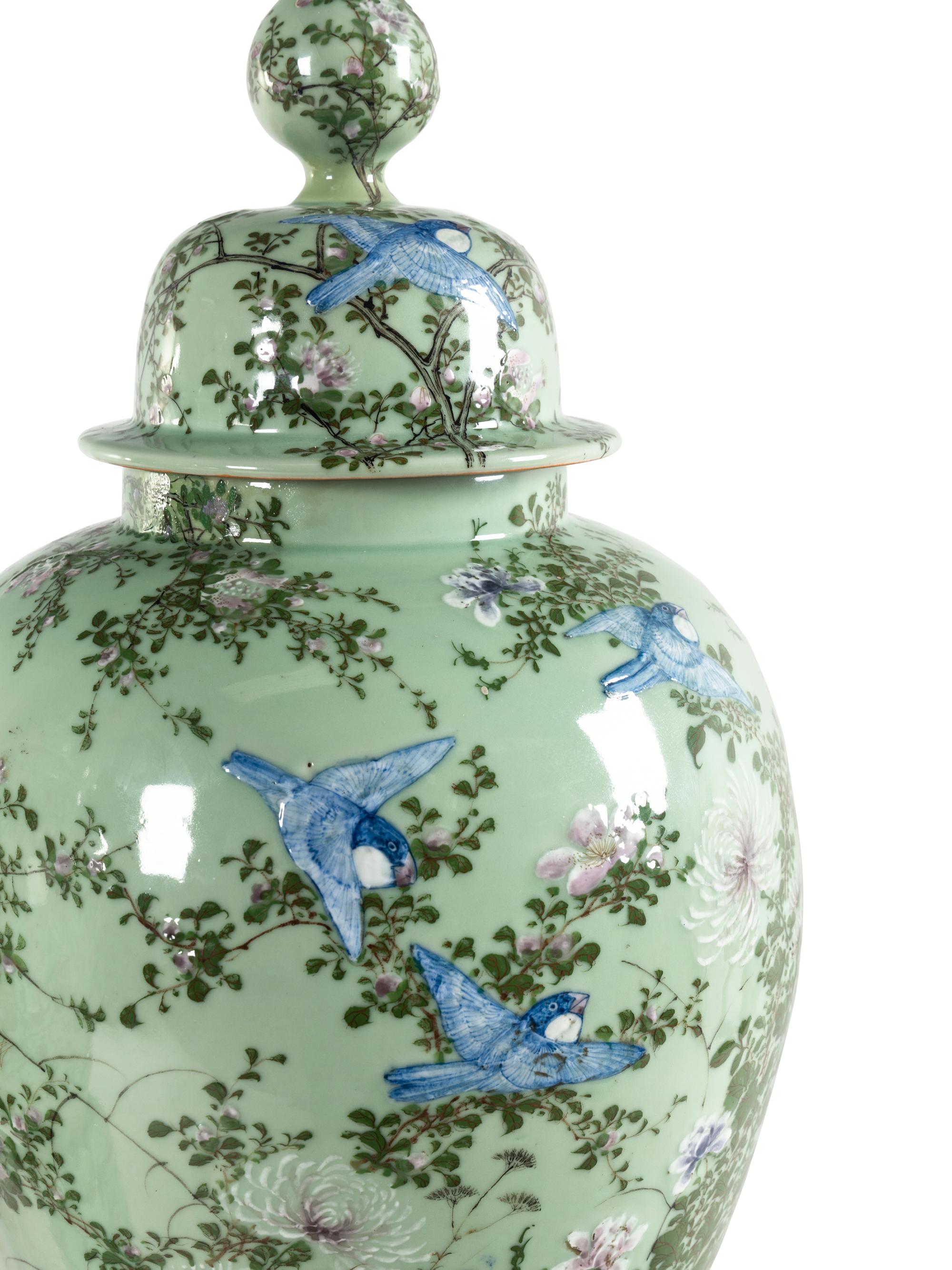 A Pair of Chinese Large Porcelain Covered Urns on Pedestals