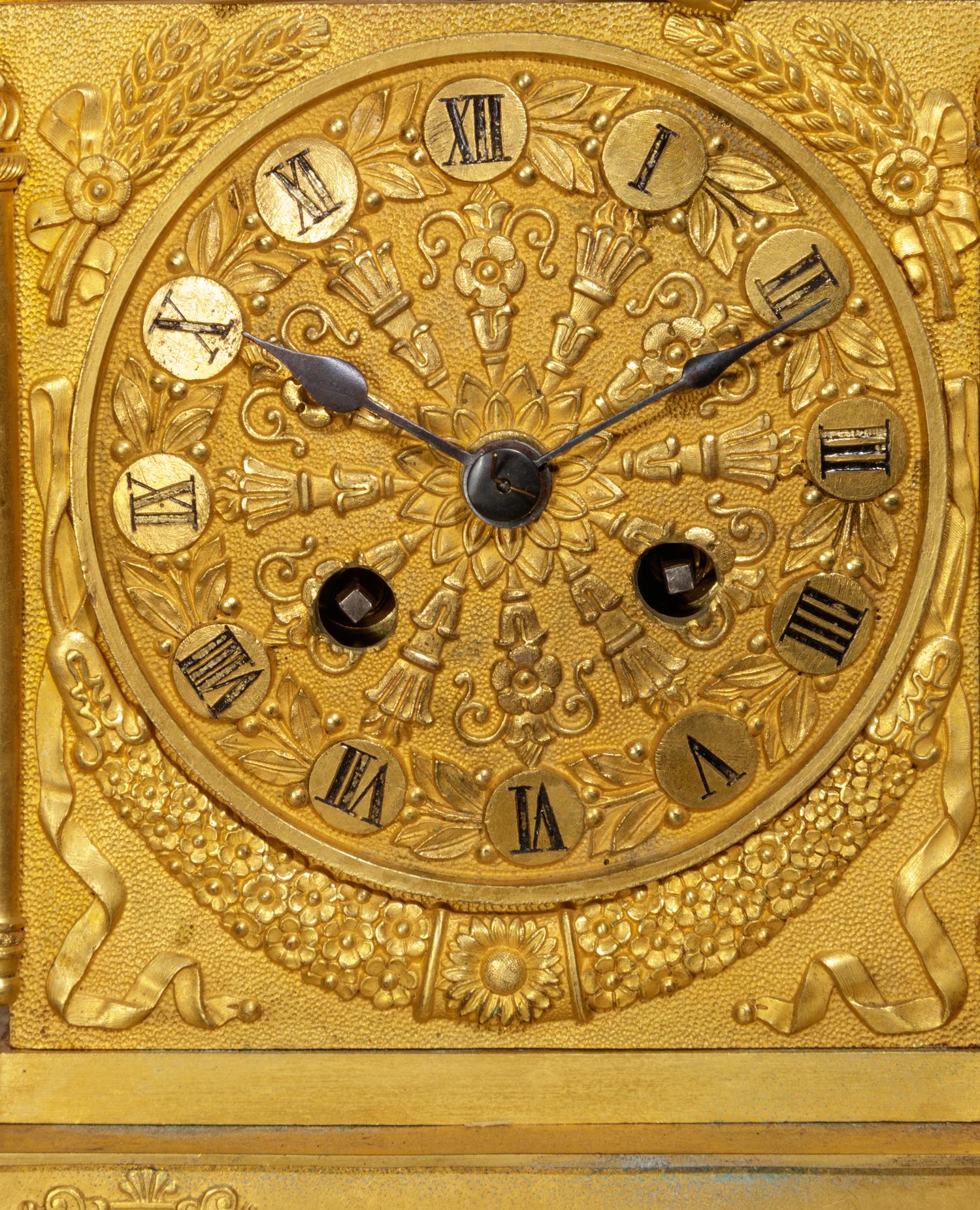 An Empire Gilt Bronze Figural Mantel Clock