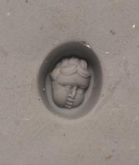 A Roman Red Jasper Ring Stone with the Head of a Baby