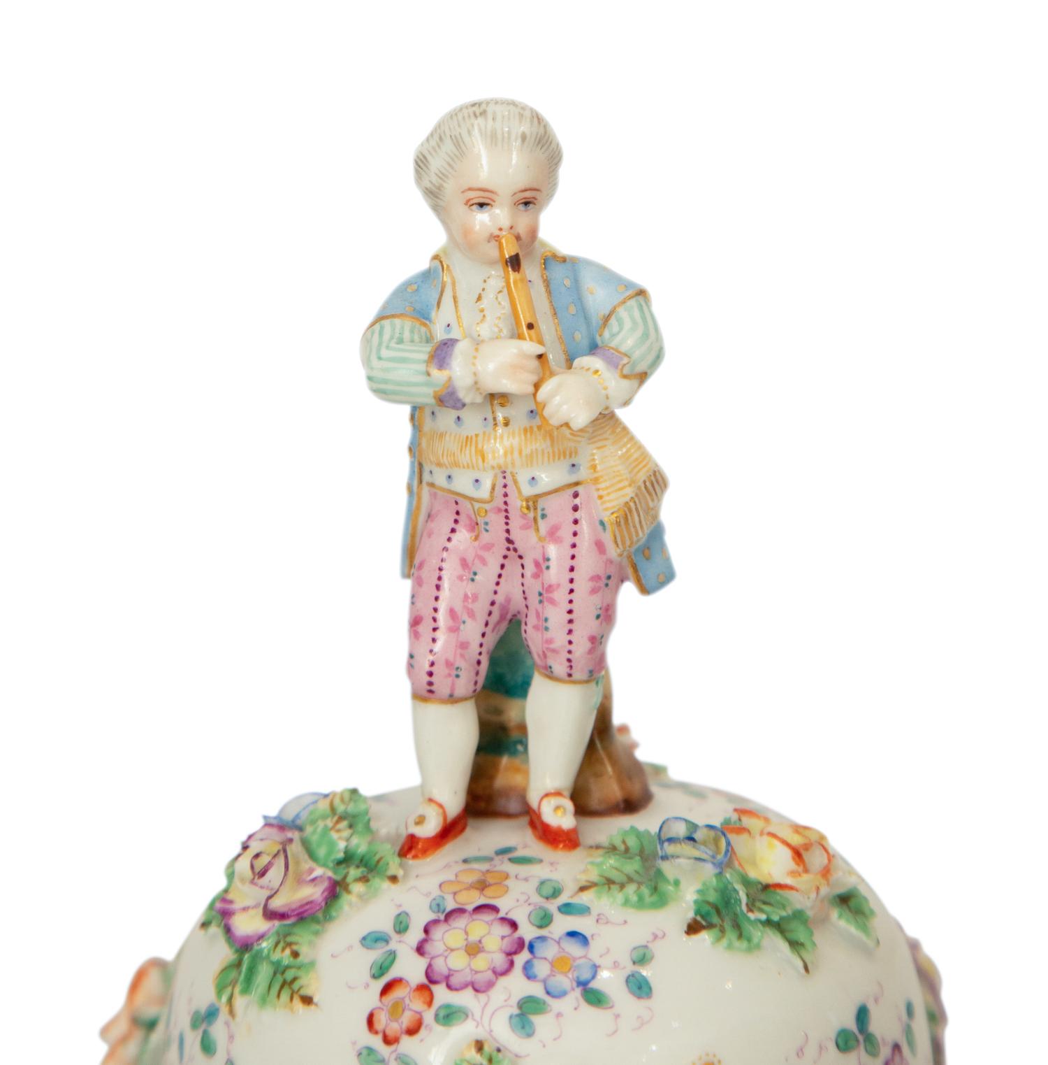 A Pair of Meissen Porcelain Covered Jars with Figural Finials