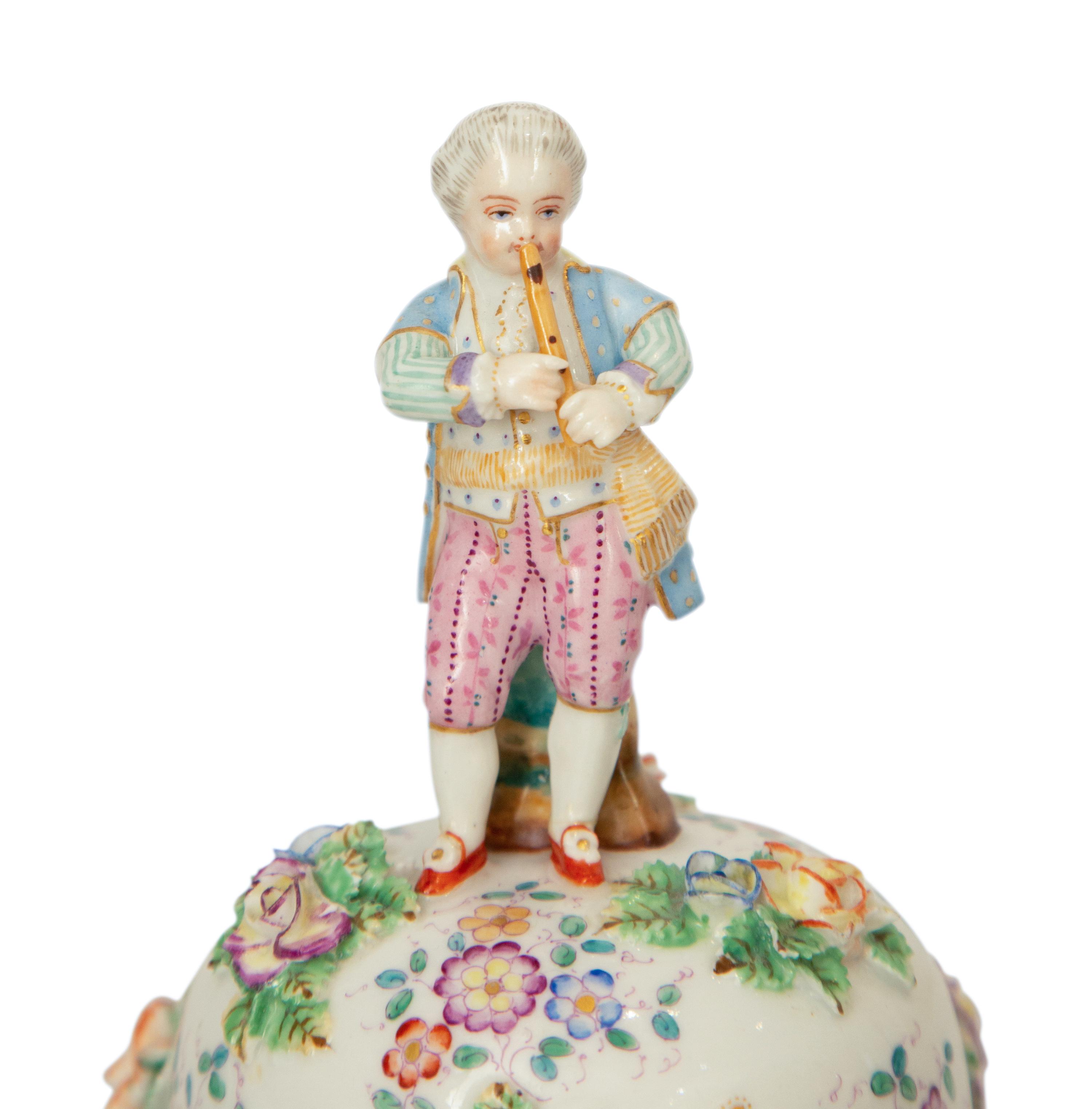 A Pair of Meissen Porcelain Covered Jars with Figural Finials