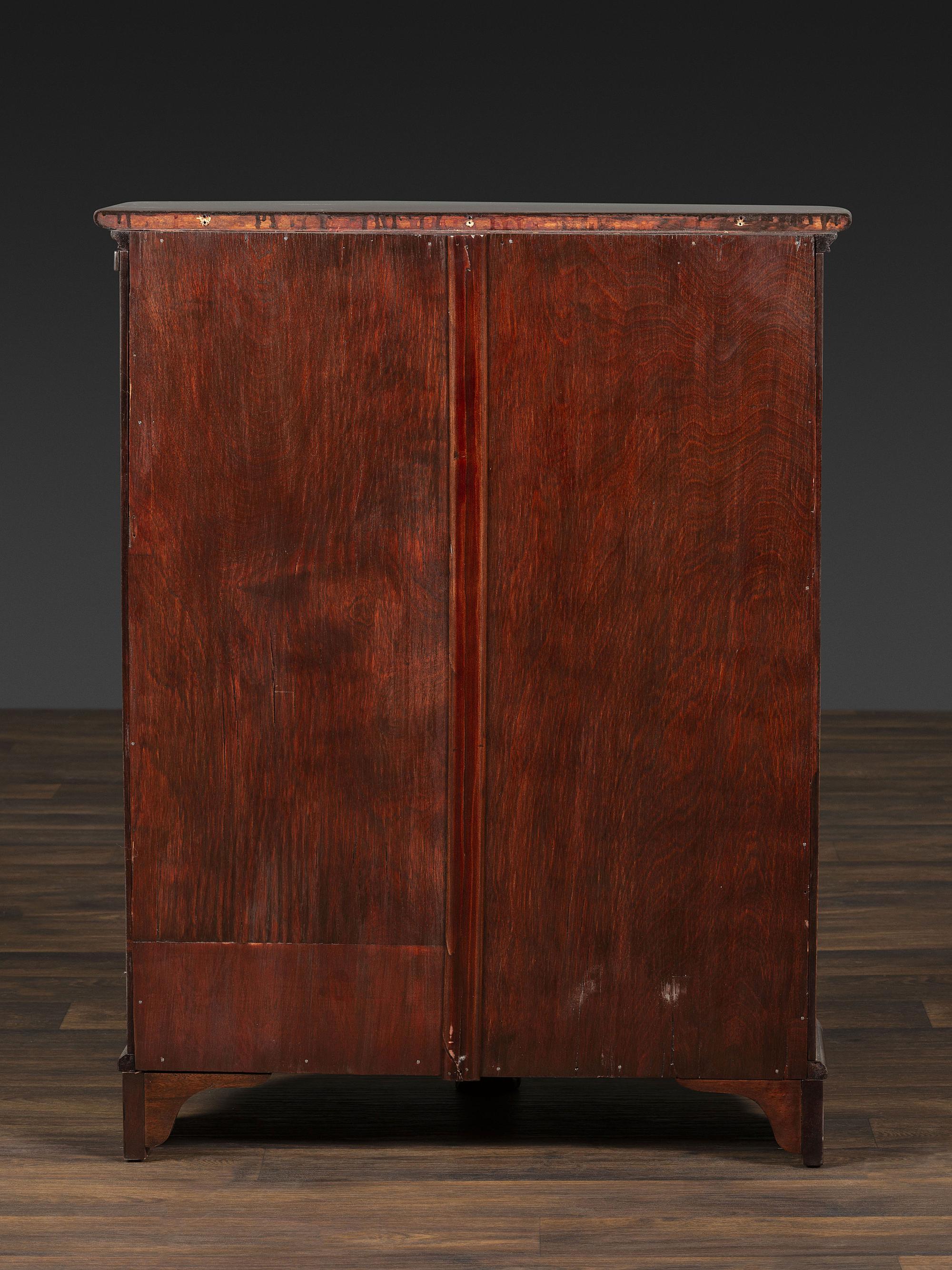 A Salter Double Bow-Front Lion Mask Carved Mahogany Record Cabinet