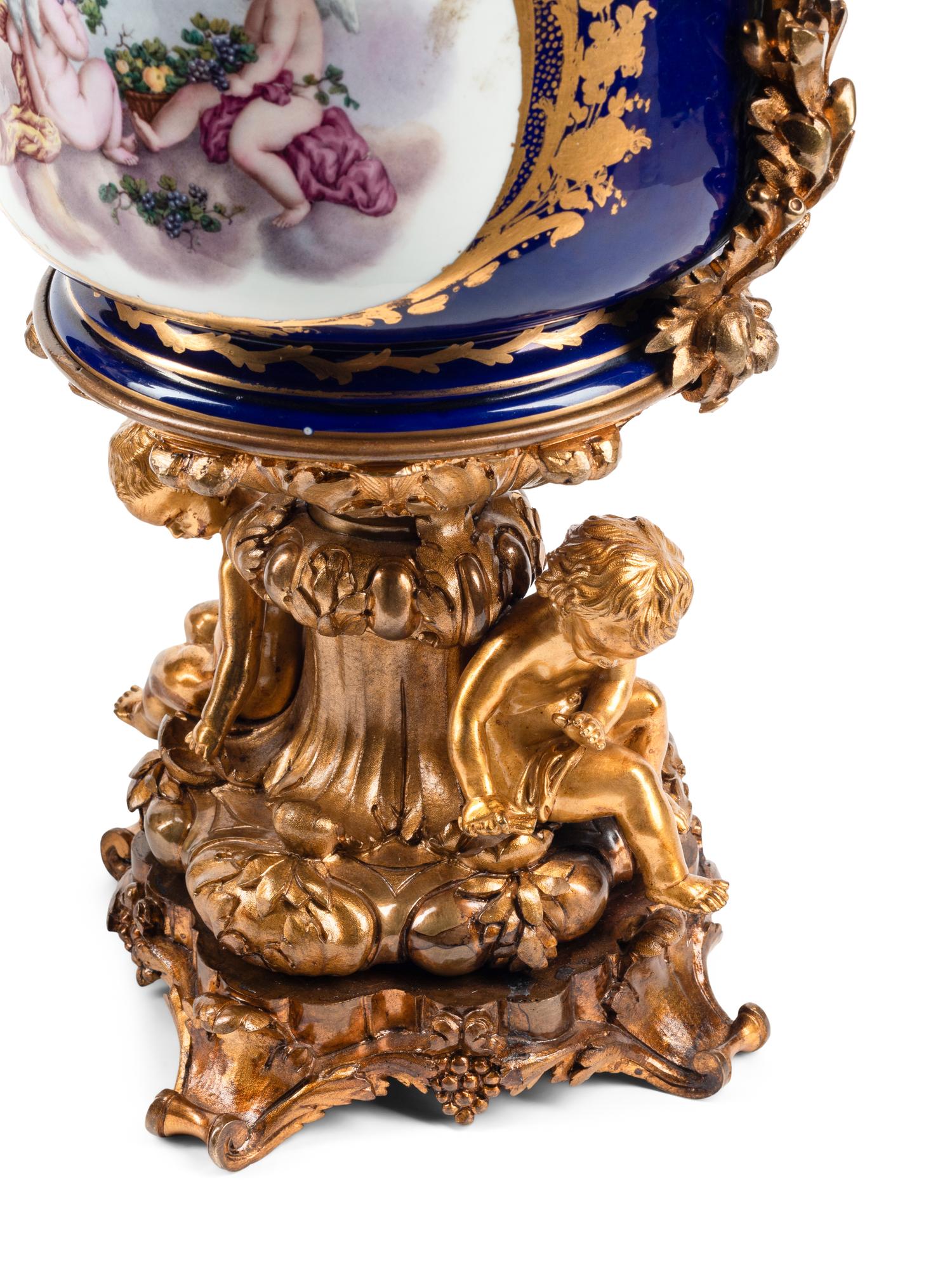 A Pair of Gilt Bronze Mounted Sèvres Style Porcelain Cache Pots