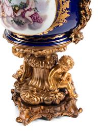 A Pair of Gilt Bronze Mounted Sèvres Style Porcelain Cache Pots
