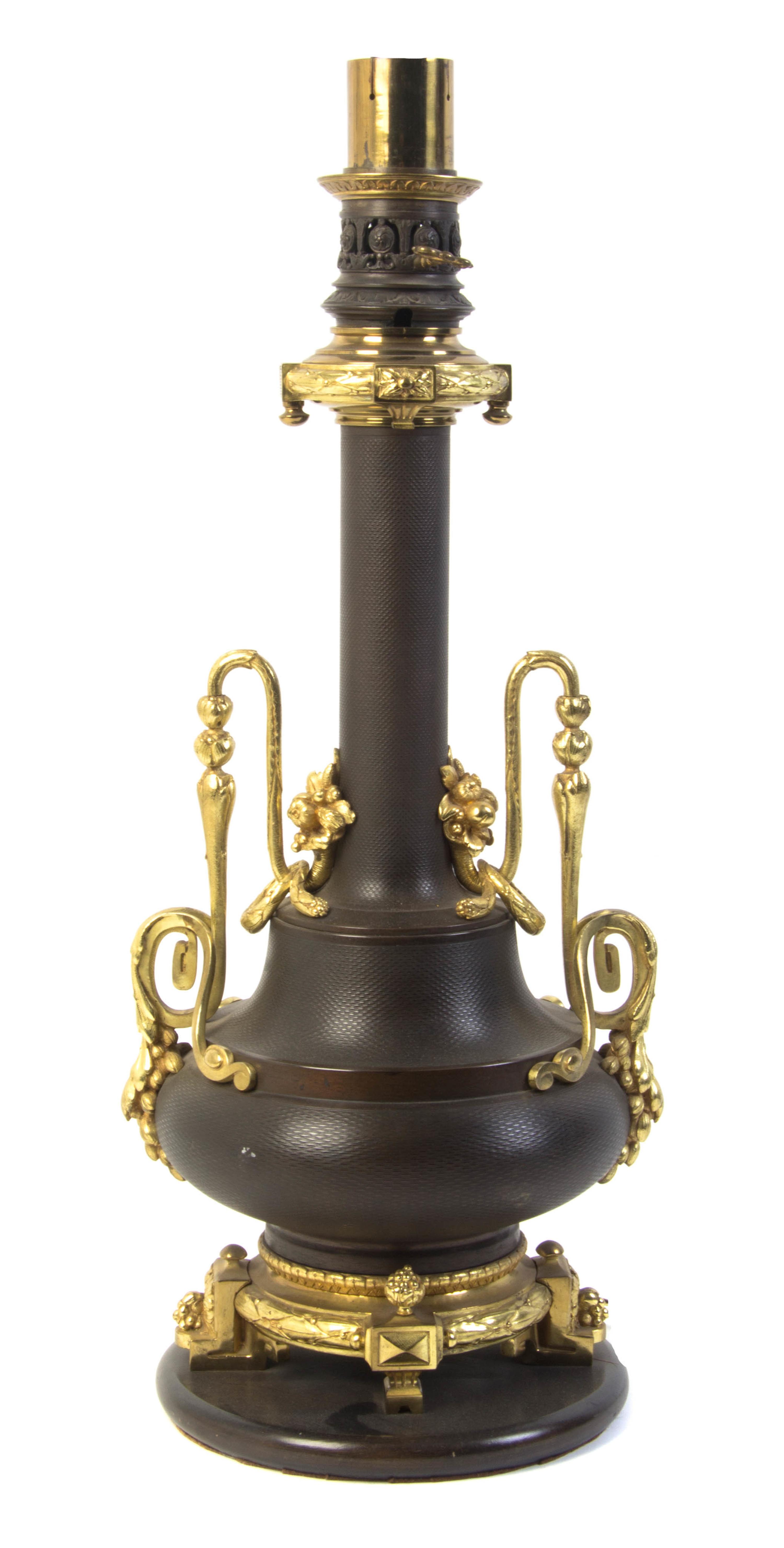 A French Gilt and Patinated Bronze Table Lamp, Height overall 37 inches.