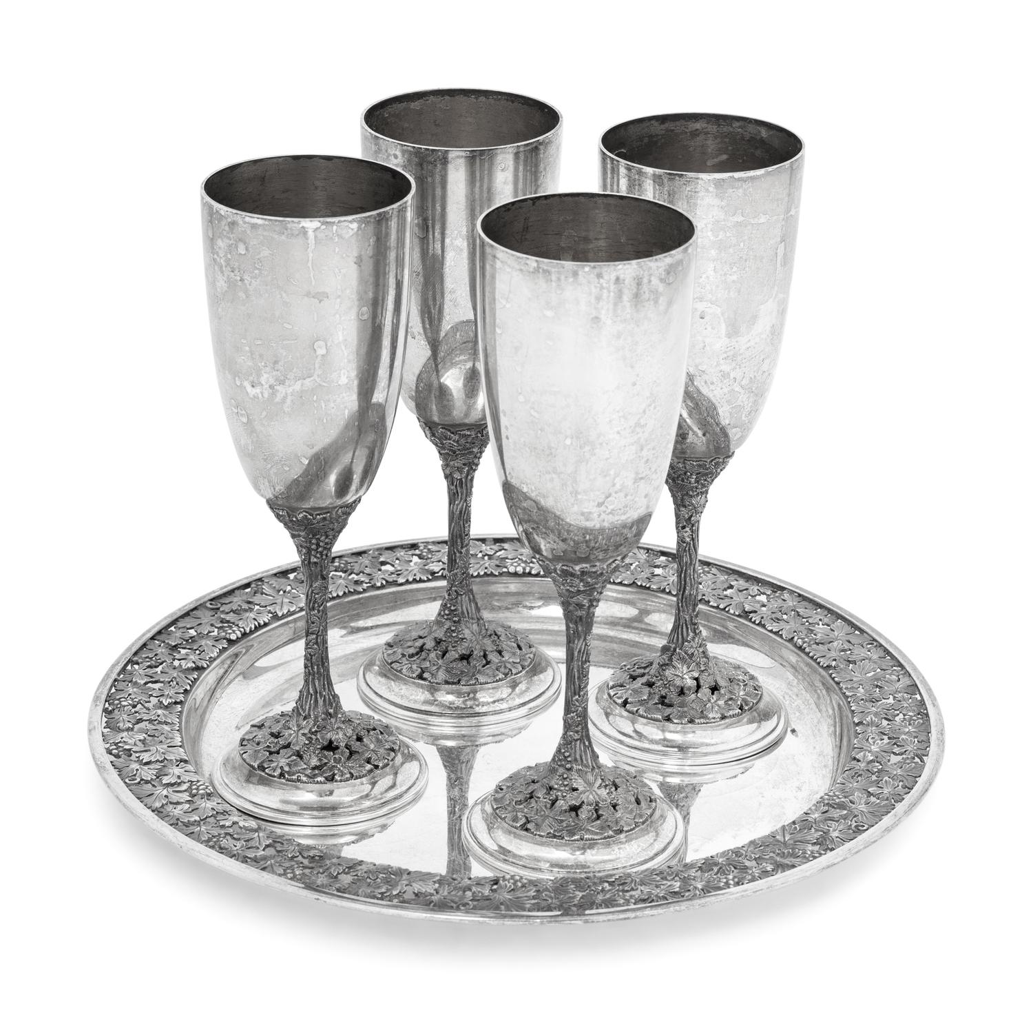 A Set of Four Asprey Silver Champagne Flutes and Tray