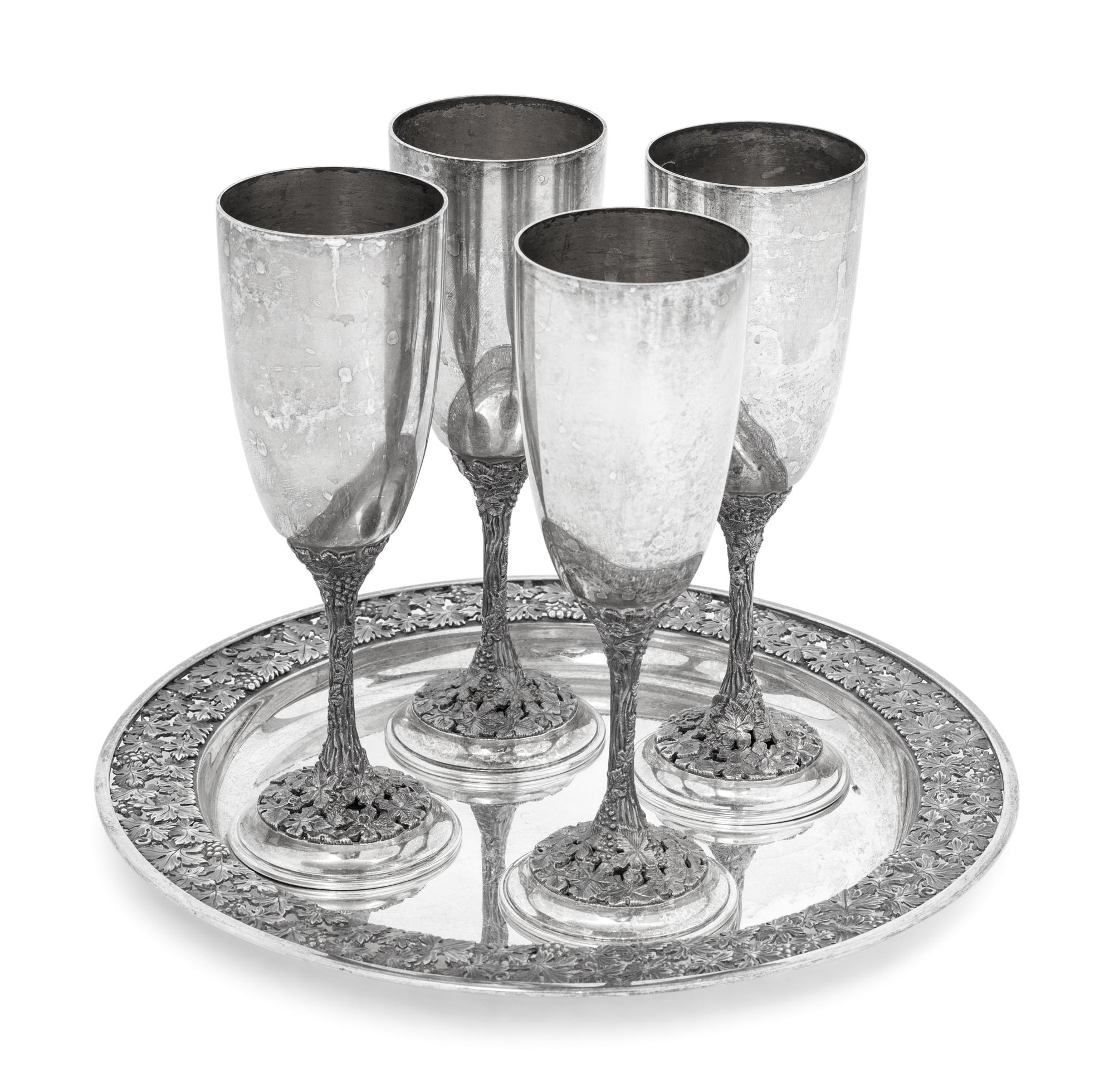 A Set of Four Asprey Silver Champagne Flutes and Tray