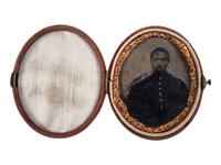 [AFRICAN AMERICANA] -- [CIVIL WAR]. Oval tintype of an African American soldier.