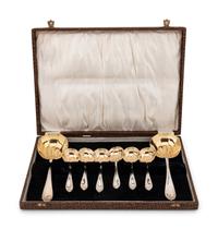 A Cased Set of Parcel Gilt SIlver-Plate Serving Spoons